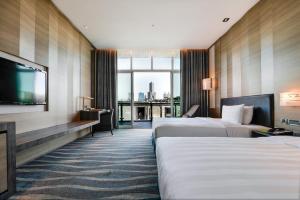 Postel nebo postele na pokoji v ubytování City Suites - Kaohsiung Chenai + 37 fotografií