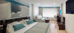 Cama o camas de una habitación en Hotel Villa del Mar