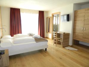 Postel nebo postele na pokoji v ubytování Hotel Alba