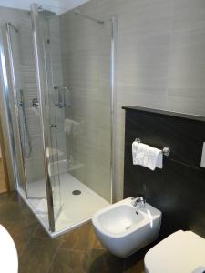 Koupelna v ubytování Hotel Alba