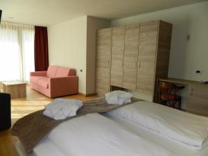 Postel nebo postele na pokoji v ubytování Hotel Alba