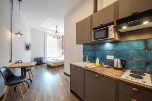 Kuchyň nebo kuchyňský kout v ubytování Secret Apartments