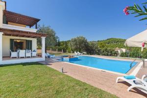 an image of a villa with a swimming pool at Seven Springs Villas in Kolymbia