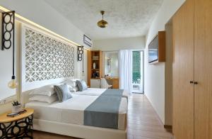 Postel nebo postele na pokoji v ubytování Vasia Boulevard Hotel (Adults Only)
