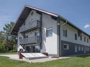 a house with balconies on the side of it at Ferienwohnung Buchenberg in Buchenberg