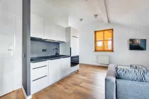 Kuchyň nebo kuchyňský kout v ubytování Apartamenty Sun & Snow Międzyzdroje Promenada