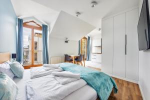 Postel nebo postele na pokoji v ubytování Apartamenty Sun & Snow Międzyzdroje Promenada