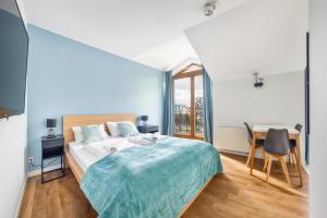 Postel nebo postele na pokoji v ubytování Apartamenty Sun & Snow Międzyzdroje Promenada