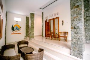 Area soggiorno di The Puncak Santhi Inn