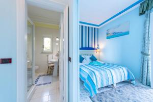 A bed or beds in a room at Hotel Villa San Michele
