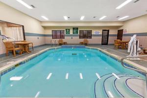 a large swimming pool in a hotel room at La Quinta by Wyndham South Bend in South Bend