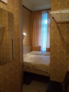 Кровать или кровати в номере Gostevoy Dom na Suhkharevke