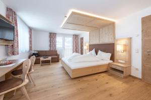 Postel nebo postele na pokoji v ubytování Hotel Theiner