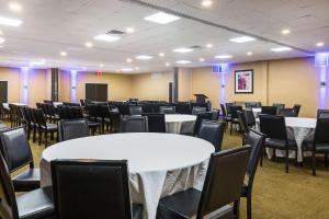 a conference room with tables and chairs in it at Pocono Inn & Banquet - Stroudsburg in Delaware Water Gap +37 photos
