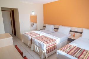 Postel nebo postele na pokoji v ubytování Portobello Park Hotel