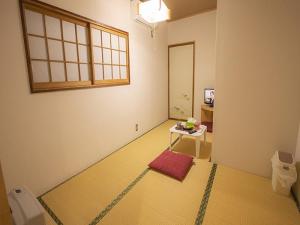 Postel nebo postele na pokoji v ubytování 金剛寺 宿坊 成穂院