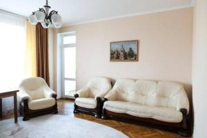 a living room with a couch and two chairs at Family apartment in the heart of Rivne in Rivne