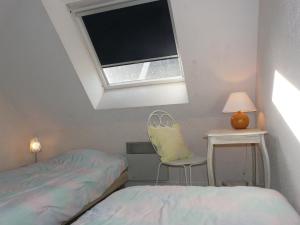 En eller flere senge i et værelse på Parc Dran Ty, Carnac