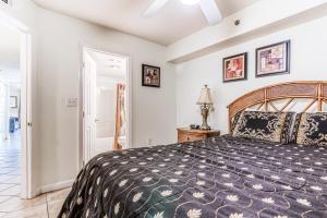 a bedroom with a large bed in a room at Four Winds in Orange Beach