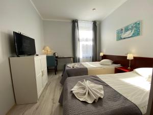 Postel nebo postele na pokoji v ubytování A1 Hotel Riga City Center