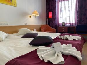 Postel nebo postele na pokoji v ubytování A1 Hotel Riga City Center
