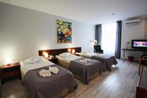 Postel nebo postele na pokoji v ubytování A1 Hotel Riga City Center