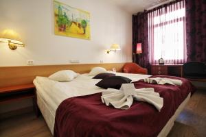 Postel nebo postele na pokoji v ubytování A1 Hotel Riga City Center