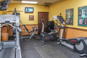 a gym with several exercise equipment in a room at Parkway International Resort in Orlando