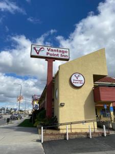 a ynergy point inn sign on the side of a building at Vantage Point Inn - Woodland Hills in Woodland Hills