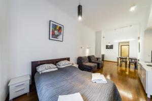 Posteľ alebo postele v izbe v ubytovaní Sewa Apartments