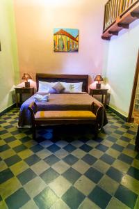 Giường trong phòng chung tại Hotel Casa del Consulado