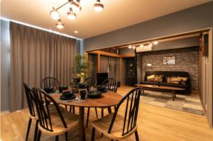 a dining room with a table and chairs and a couch at Secret House - 2 min to FuSe station - in Osaka +41 photos