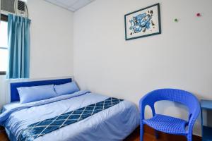 Postel nebo postele na pokoji v ubytování 東石愛琴海藝宿文旅 合法民宿272