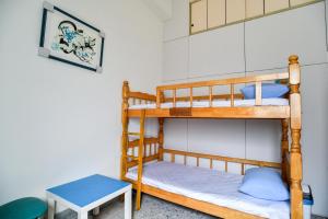 Postel nebo postele na pokoji v ubytování 東石愛琴海藝宿文旅 合法民宿272