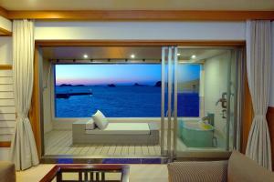 a room with a large window with a bath tub at IKI RETREAT by Onko Chishin in Iki