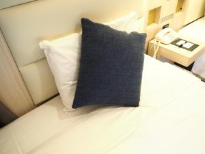 Postel nebo postele na pokoji v ubytování Hotel Sunroute Stellar Ueno