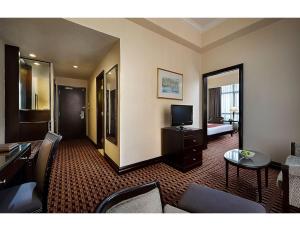 TV a/nebo společenská místnost v ubytování Berjaya Penang Hotel