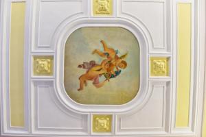 a painting of a woman on a ceiling at ANFITEATRO LE SUITES in Catania