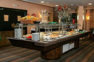 a buffet of food on a table in a hotel at RVHotels Tuca in Vielha