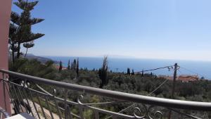 a view of the ocean from the balcony of a house at eleni studios in Vlachata