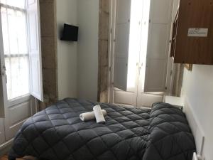 Ein Bett oder Betten in einem Zimmer der Unterkunft PR Paz de Agra