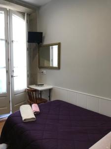 Ein Bett oder Betten in einem Zimmer der Unterkunft PR Paz de Agra