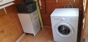 a washer and dryer in a tiny house at chalet Bati in Bonifacio