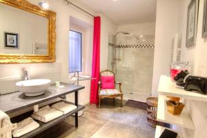 a bathroom with a sink and a mirror and a shower at Les Remparts Antibes Location in Antibes +37 photos