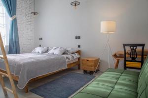 Postel nebo postele na pokoji v ubytování Domestic House Lola