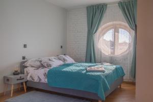 Postel nebo postele na pokoji v ubytování Domestic House Lola