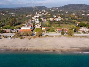 an aerial view of a beach with a town at Laconian Collection Mavrovouni Beach House (Left) in Gythio