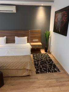 Cama ou camas em um quarto em Hotel Calipso Hotel
