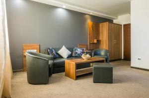 Uma área de estar em Hotel Calipso Hotel