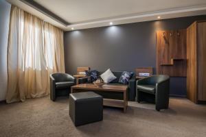 Uma área de estar em Hotel Calipso Hotel